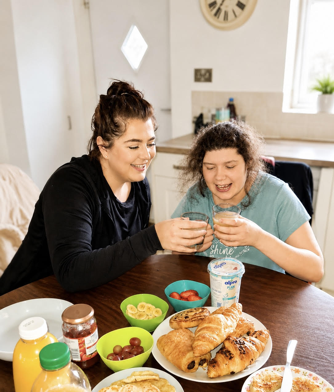 Palmerston Care support worker sharing breakfast with a client at home